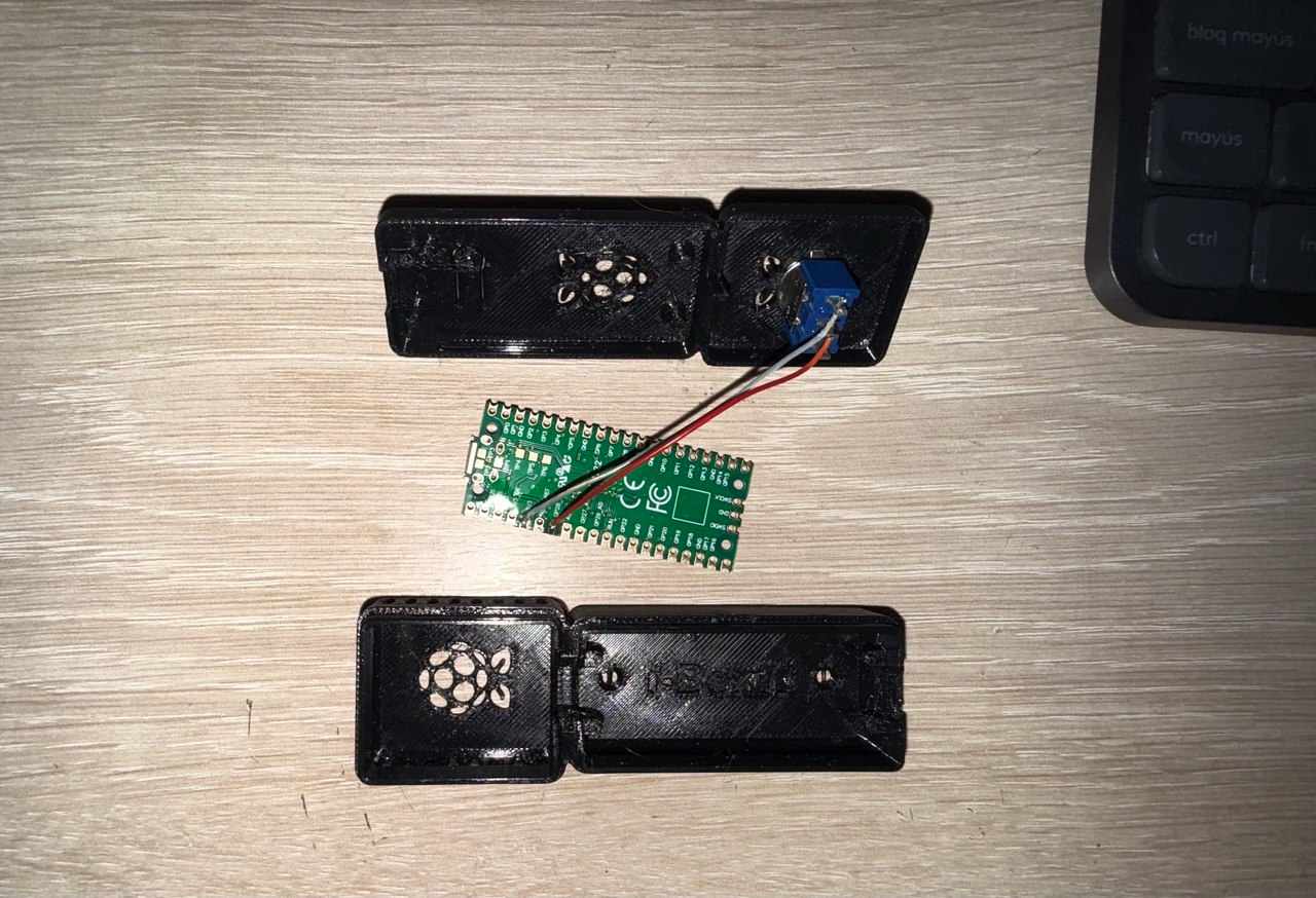 Teardown showing both enclosure halves and the Pico before wiring